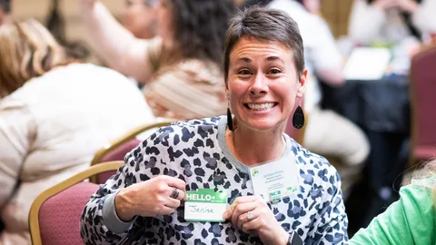 A 4-H volunteer holds an LED nametag that she made during an electric workshop at the North Carolina 4-H Volunteer Leaders' Conference.