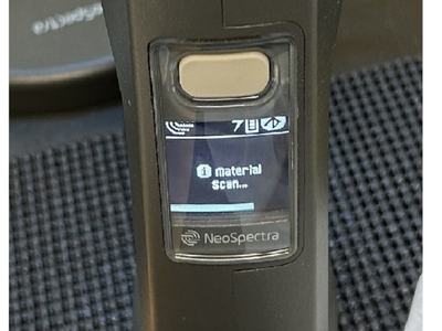 Image of a near-infrared device scanning a sample.
