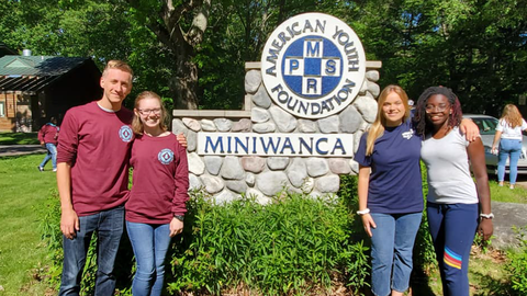 North Carolina 4-H youth stand in front of the American Youth Foundation Miniwanca sign while participating in National Leadership Conference.