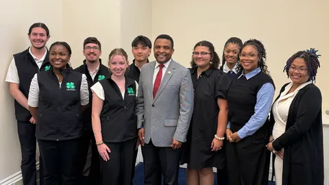 North Carolina 4-H youth delegation posing with a U.S. Representative during a visit to the U.S. Capitol at National 4-H Conference.