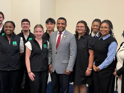 North Carolina 4-H youth delegation posing with a U.S. Representative during a visit to the U.S. Capitol at National 4-H Conference.
