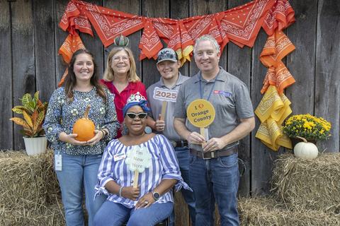 Orange County Employees pose together at an employee appreciation event