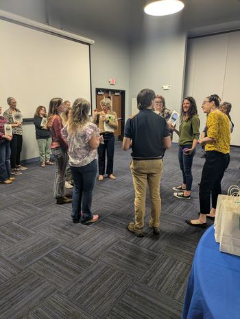 Dr. Bloom leading the activity "Weaving the Web" during the EMFV New Agent Training. This hands-on activity demonstrates how the food system is like a web, and how local food systems can differ from food systems at other scales.