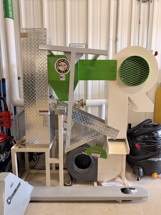 This is a commercial Pecan Nut Busters machine, a specialized agricultural tool used for shelling and cleaning pecans.