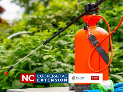 a red pesticide container among plants