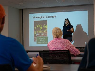 Gabriella de Souza giving a presentation.