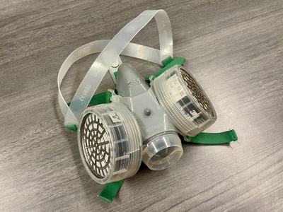 Image of a half-face respirator mask with cartridge filters