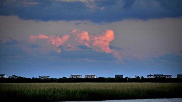 Brunswick County storm clouds over a field.
