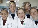 4-H Students in laboratory protective clothing.