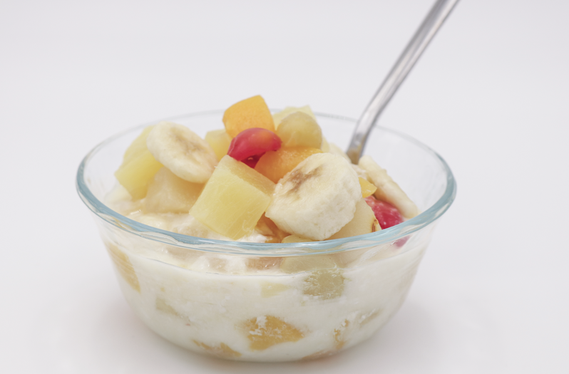 easy fruit salad in a bowl with a spoon