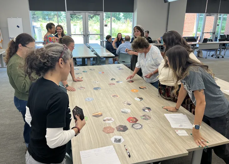 Community partners work together on a connection before content activity