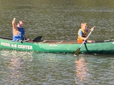 4-H canoeing in creek.