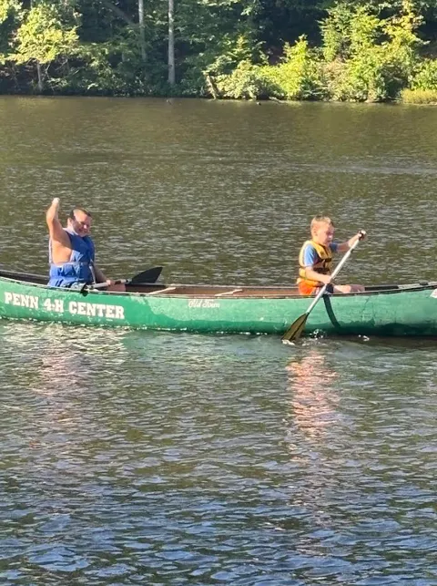 4-H canoeing in creek.
