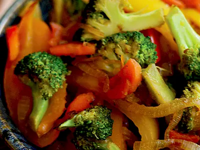 Stir fry with bell peppers broccoli carrots and onions