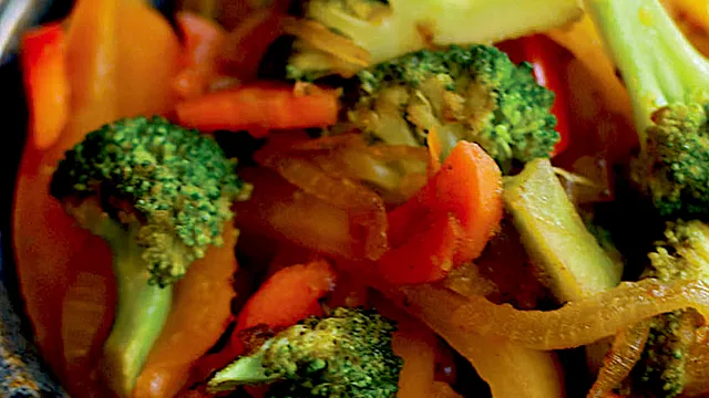 Stir fry with bell peppers broccoli carrots and onions