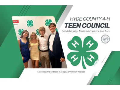 Four Hyde County 4-H youth posing for a photograph with a 4-H and NC State Extension branded backdrop.