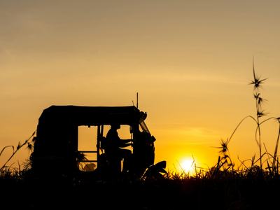 Tractor in the field at sundown