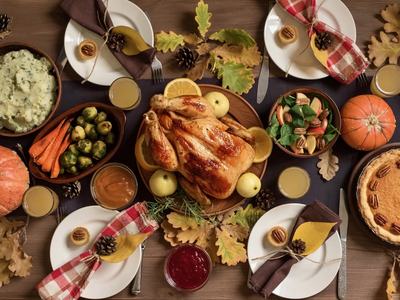 Baked Turkey on a table with side dishes