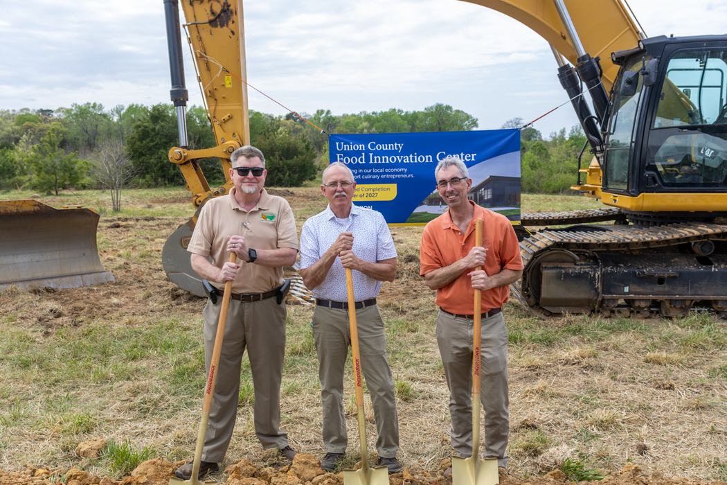 Staff from North Carolina Tobacco Trust Fund holding gold shovels
