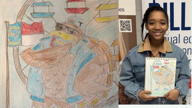 Jamara Oliver holding her drawing of a turkey with ferris wheel and state flag.