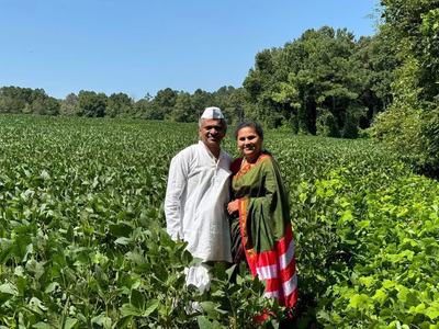 man and woman in field