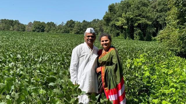 man and woman in field