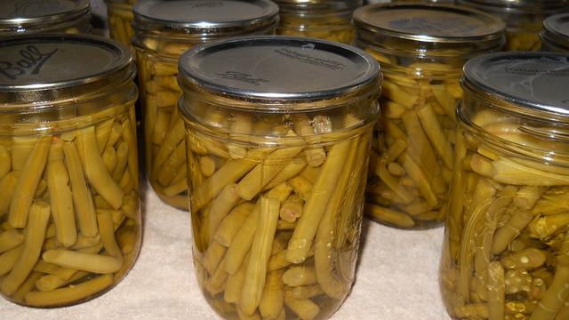 Glass jars of canned green beans