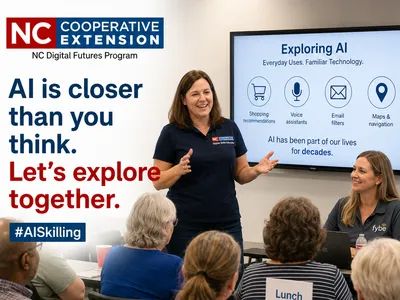 AI workshop leader teaches residents practical AI skills in a classroom.