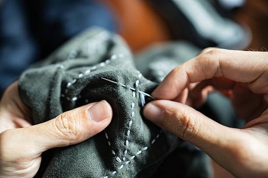 Hand mending clothes