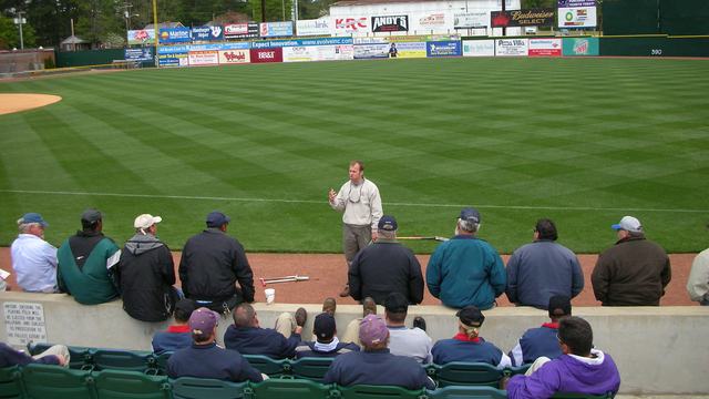 An extension speaker giving maintenance instructions at a baseball field
