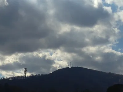 darker clouds over mountains