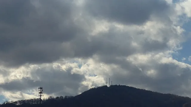 darker clouds over mountains