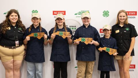 Members of the Currituck County Slicers pose with their bronze award during the 2026 Dinah Gore 4-H Healthy Food Challenge.