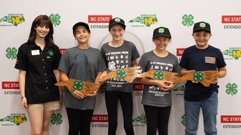 Members of the Orange County Cooking Pickles pose with their silver award during the 2026 Dinah Gore 4-H Healthy Food Challenge.