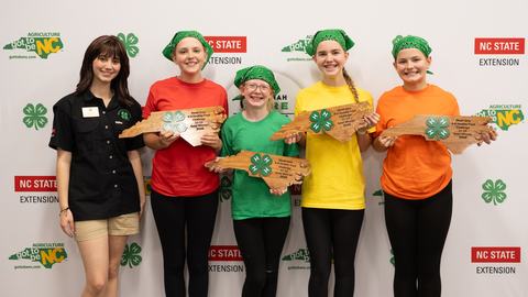 Members of the Harnett County Belle Peppers pose with their gold award during the 2026 Dinah Gore 4-H Healthy Food Challenge.
