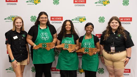 Members of the Wilson Cooking Clovers pose with their silver award during the 2026 Dinah Gore 4-H Healthy Food Challenge.