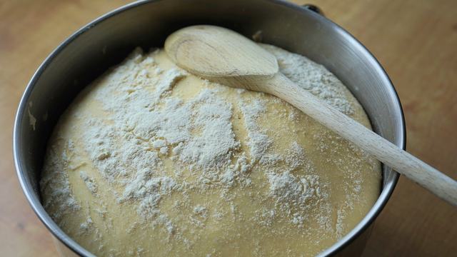 Sourdough bread in a baking pan.