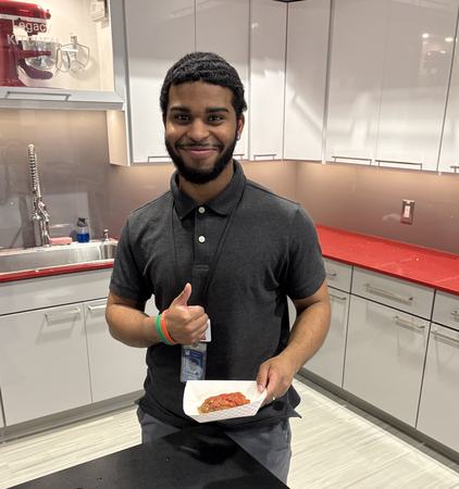 Elijah holding a cooked meatloaf