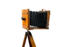 A still life of antique camera equipment, including a wooden tripod.