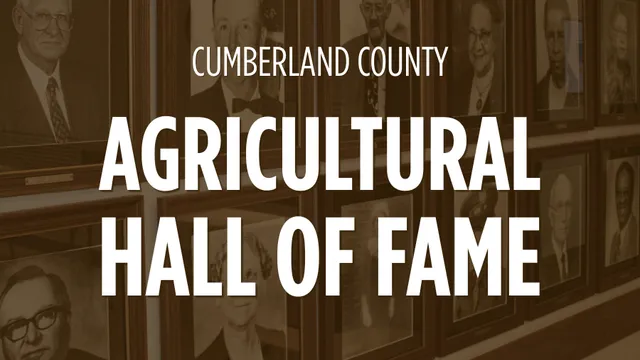 A photo of part of the Agricultural Hall of Fame portraits with the white text over brown photos.