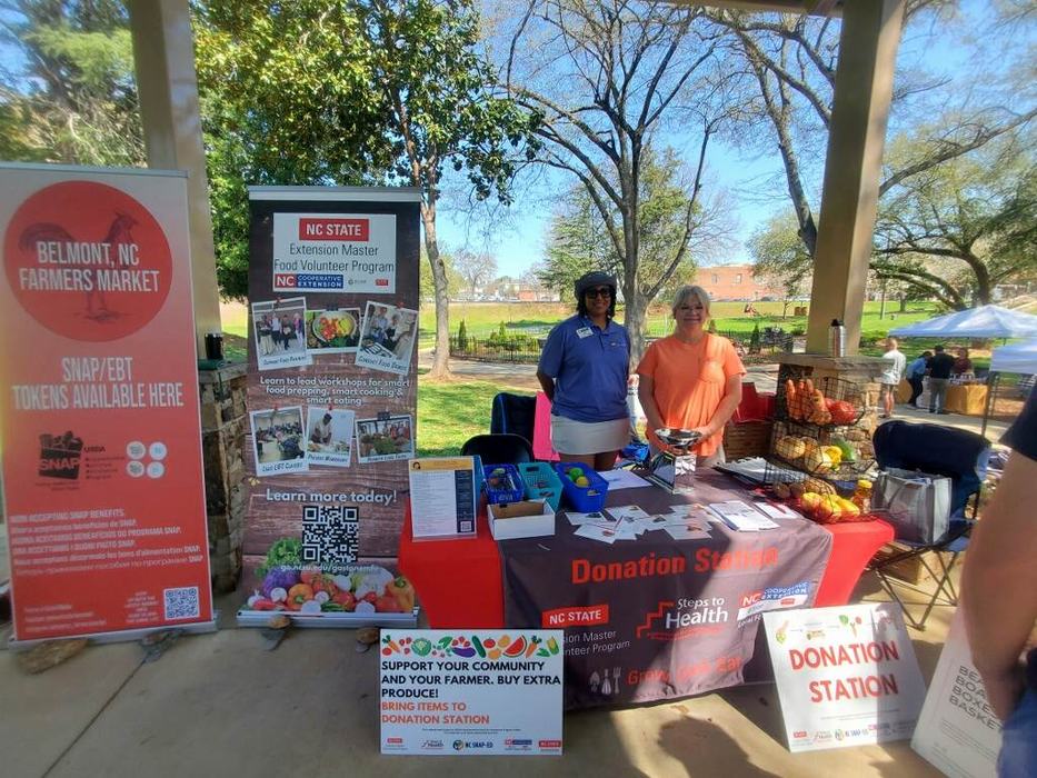 Jonette Mungo and Leesa Haselden pose at the Donation Station in Belmont, NC.