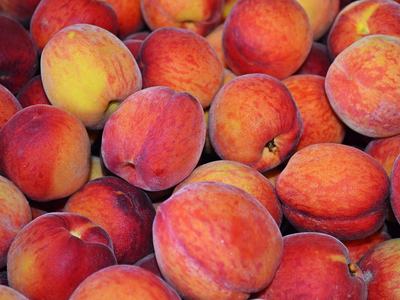 Several ripe peaches
