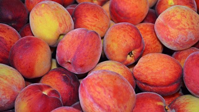 Several ripe peaches
