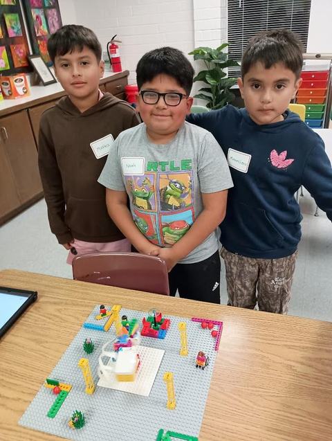 Children participating in a lego robotics program