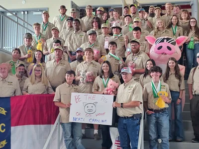North Carolina 4-H Shooting Sports delegation posing together after the National 4-H Shooting Sports Championships, many displaying medals and ribbons.