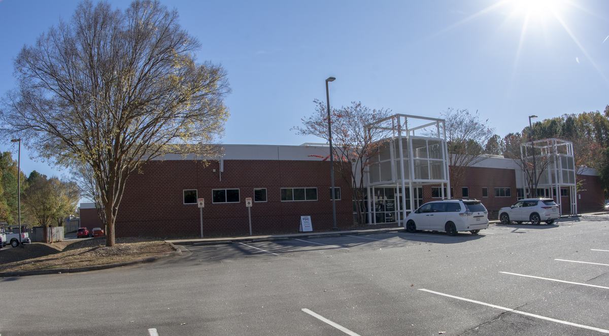 Photo from the parking lot showing the front of the building where the PDIC is located