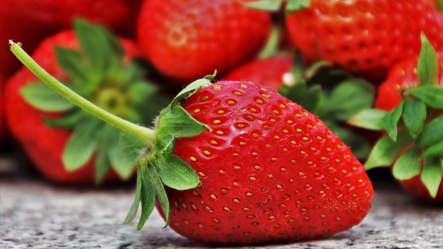 Ripe red strawberries to be used for a fruit salsa recipe