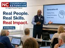 AI workshop leader teaches residents practical AI skills in a classroom.