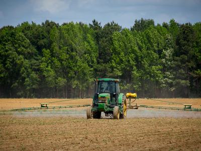 farmer on sprayer in field