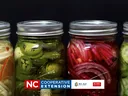 jars of peppers, onions and cucumber pickles